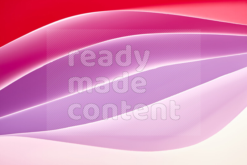 This image showcases an abstract paper art composition with paper curves in white and different warm gradients created by colored light