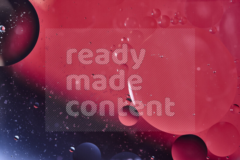 Close-ups of abstract oil bubbles on water surface in shades of black and red