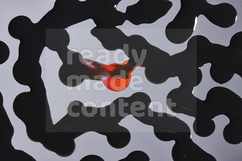 خلفية ملونة مع مزيج من ألوان الطلاء الأحمر والاسود