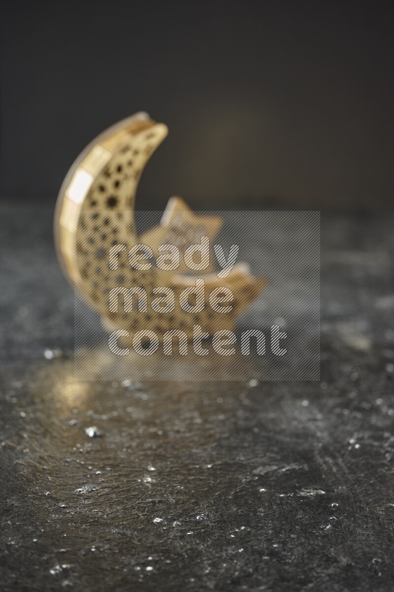 An out of focus lantern on textured black background