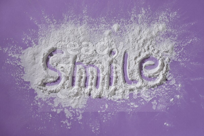 A word written with powder on purple background