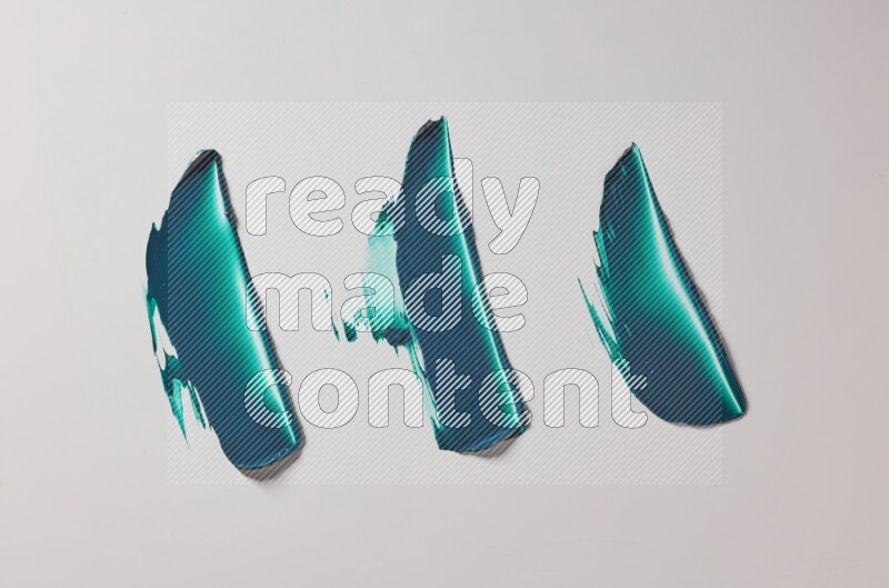Turquoise painting knife strokes on white background
