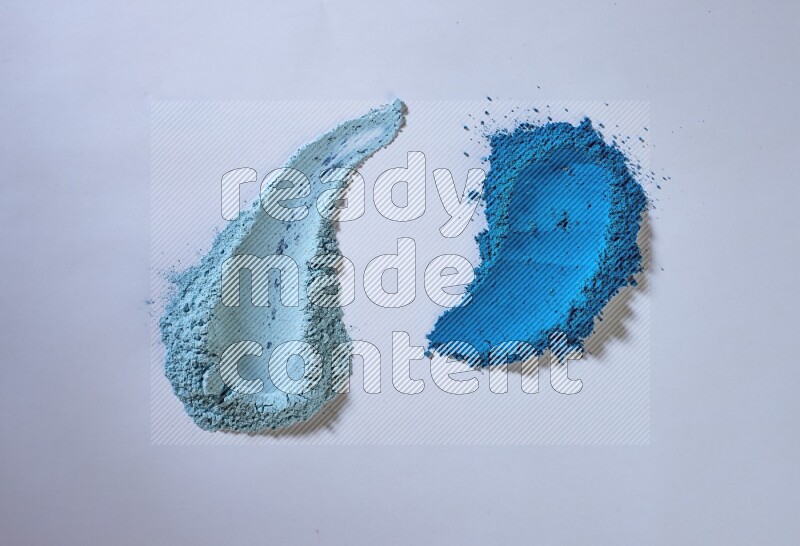 Blue powder strokes on white background