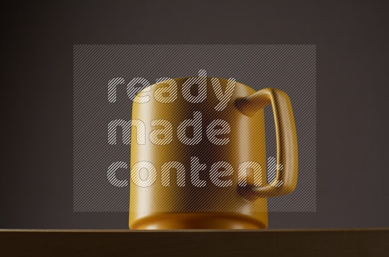 Low angle shot of a yellow cup on grey background