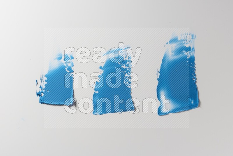 Blue painting knife strokes on a white background