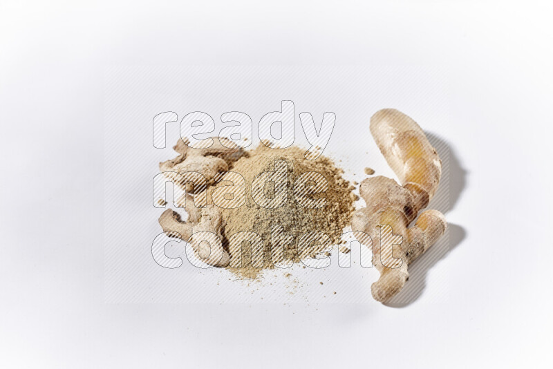 A bunch of ground ginger powder on white background