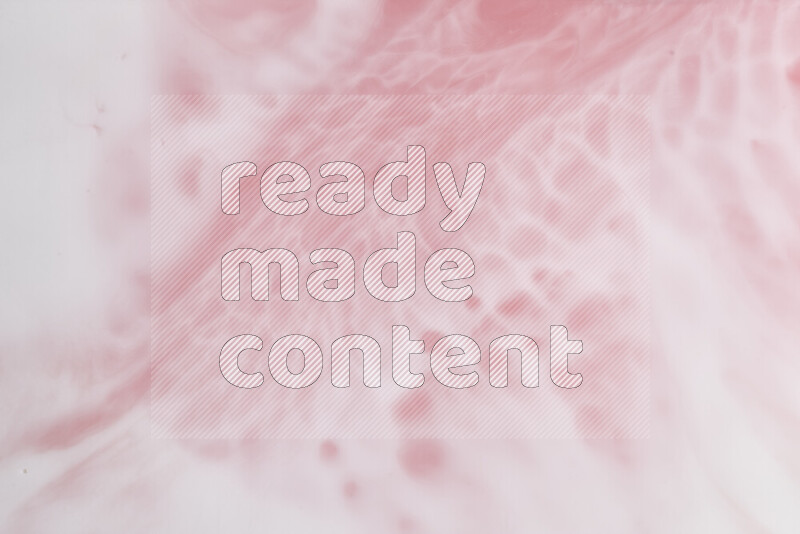 A close-up of abstract swirling patterns in red and white