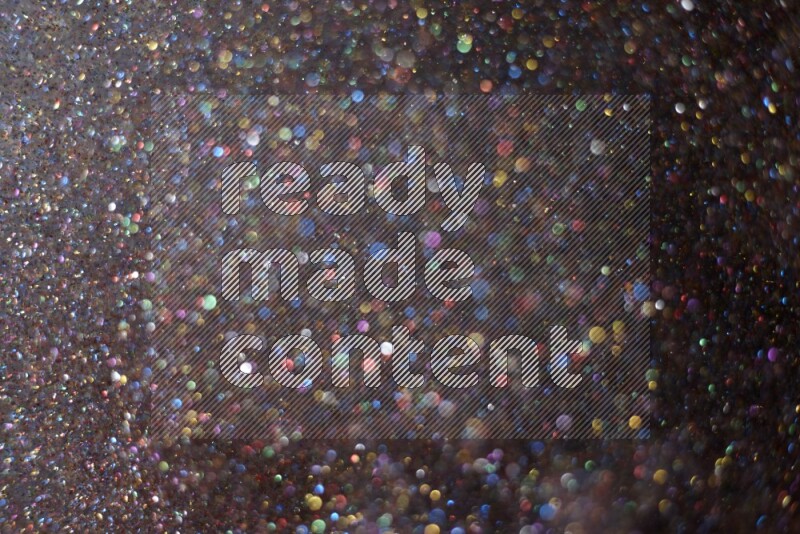 Multicolored glitter powder isolated on black background