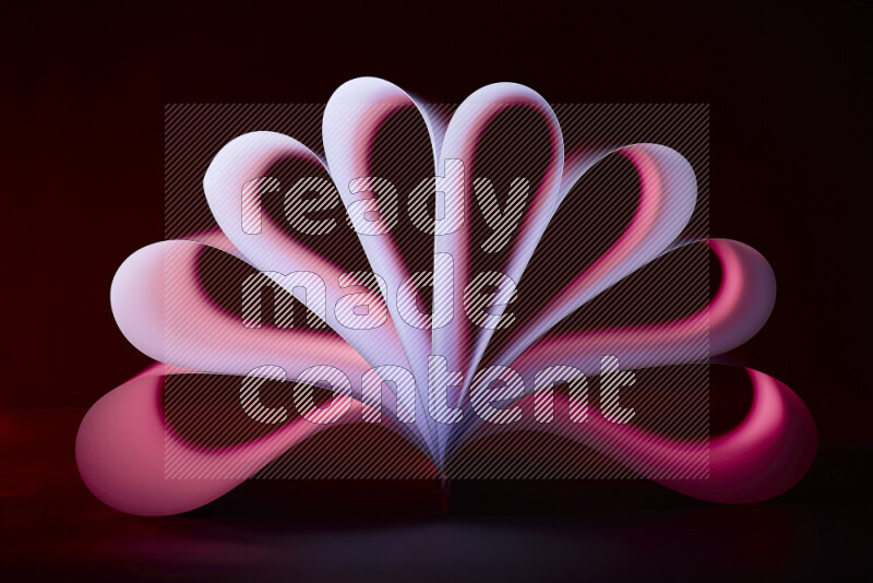 An abstract art piece displaying smooth curves in pink and purple gradients created by colored light