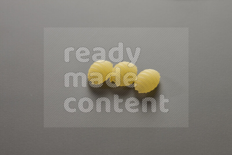 Shells pasta on grey background