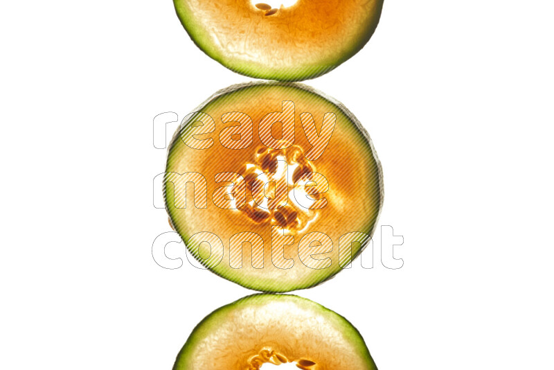 Cantaloupe slices on illuminated white background