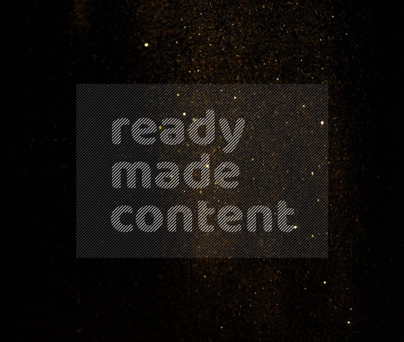 Gold glitter powder isolated on black background