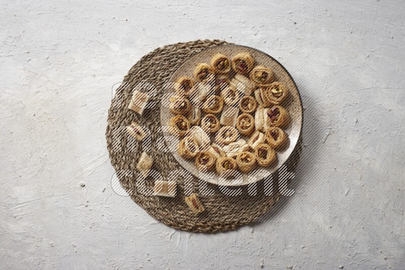 Oriental sweets in pottery plates in a light setup