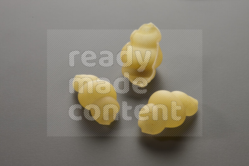 Snails pasta on grey background