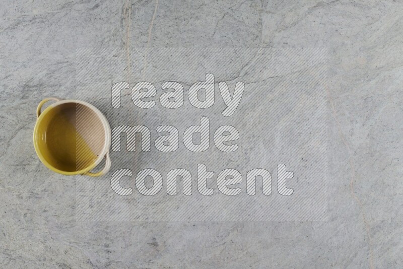 A multicolored pottery Bowl on grey marble background