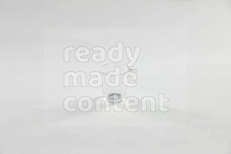 Glassware such as coffee pot, cup, saucer and jar on white background