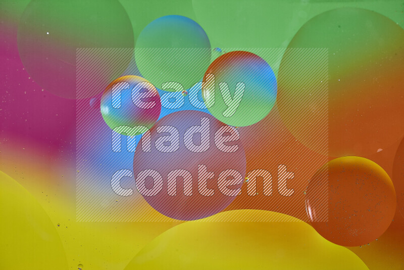 Close-ups of abstract oil bubbles on water surface in multicolors