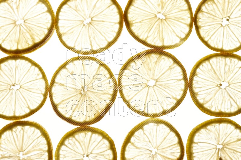 Lemon slices on illuminated white background