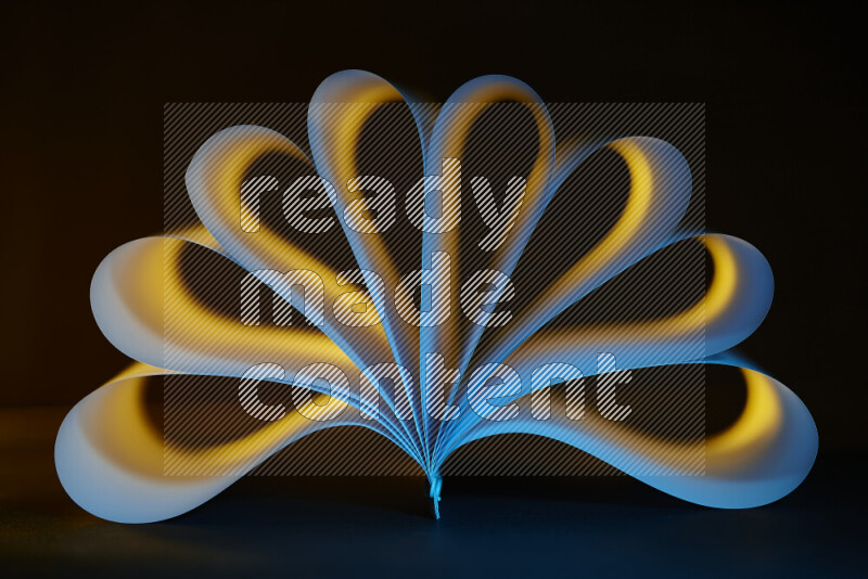 An abstract art piece displaying smooth curves in yellow and blue gradients created by colored light