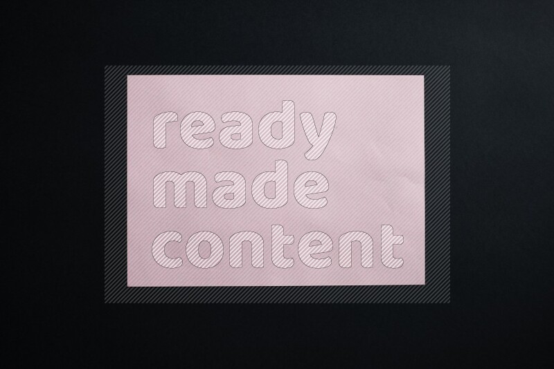 Pink paper sheet on black background