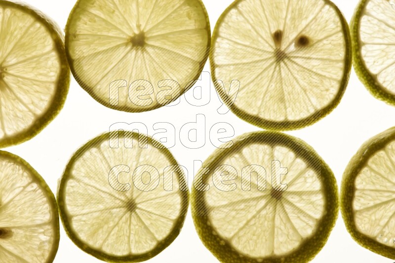 Lemon slices on illuminated white background