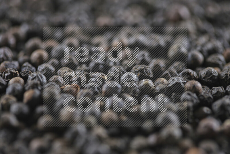 Black pepper beads on white background