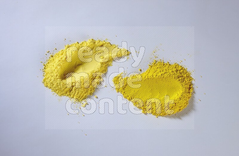 Yellow powder strokes on white background