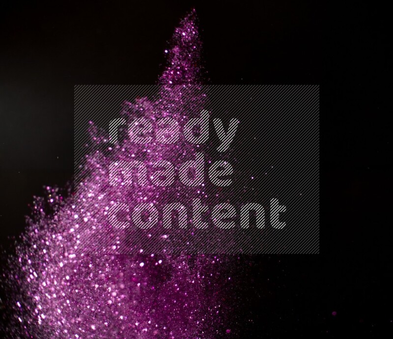 Pink glitter powder isolated on black background