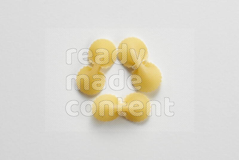 Fiocchi pasta on white background