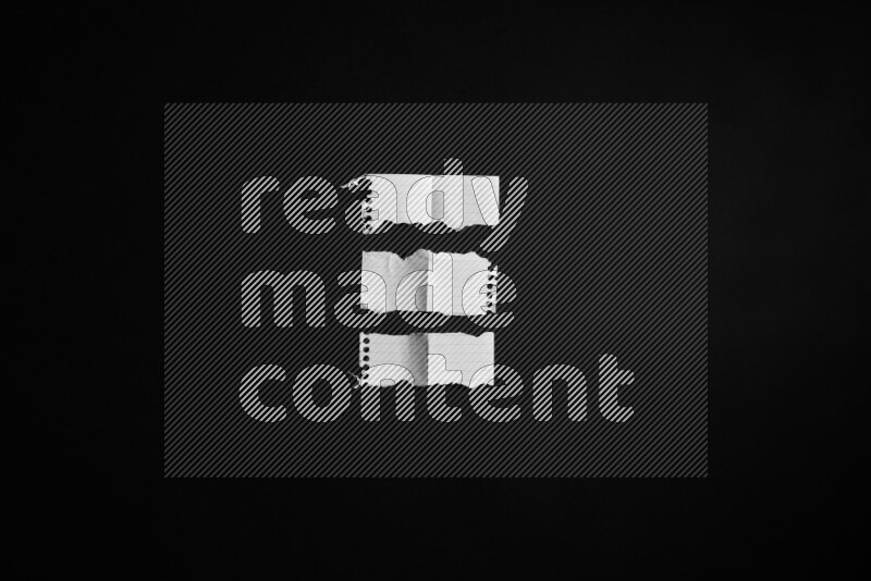 Ripped notebook sheet on black background