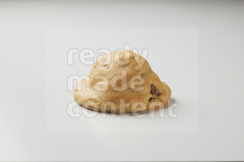a chocolate chip cookie on a white background