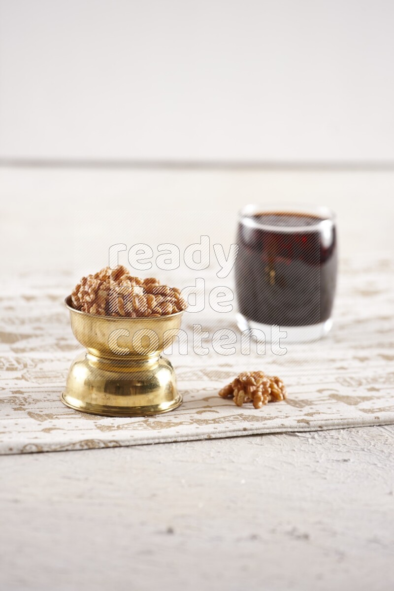 Nuts in a metal bowl with tamarind in a light setup