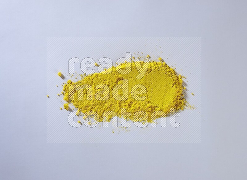 Yellow powder strokes on white background
