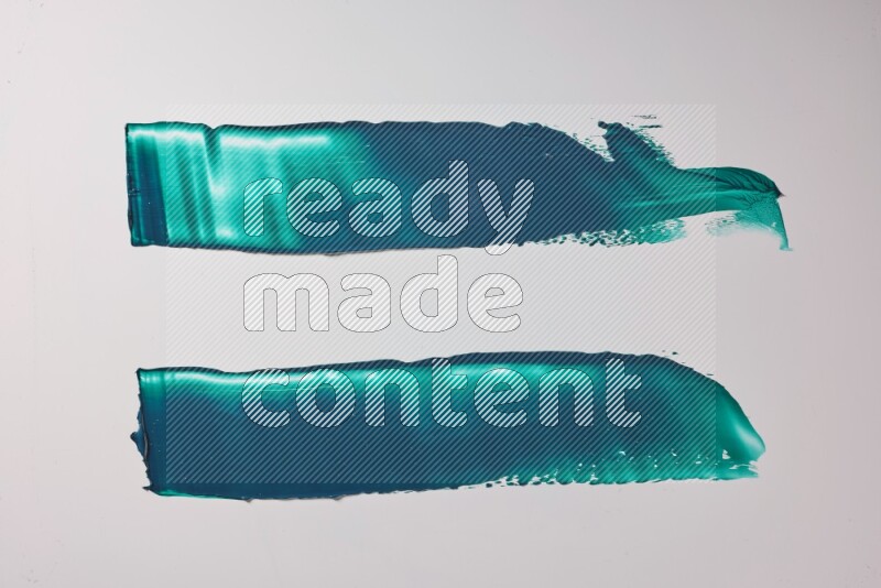 Turquoise painting knife strokes on white background