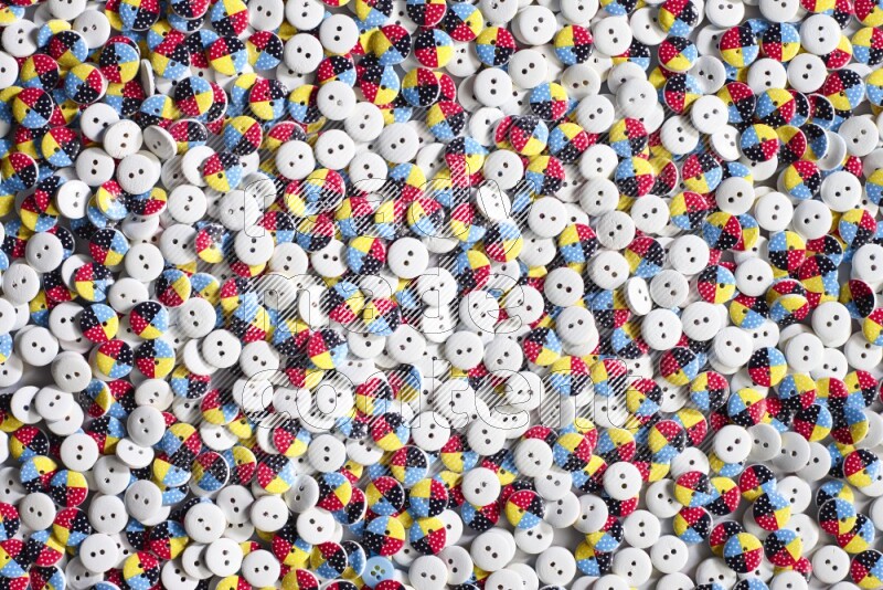 Multicolored buttons placed on grey background