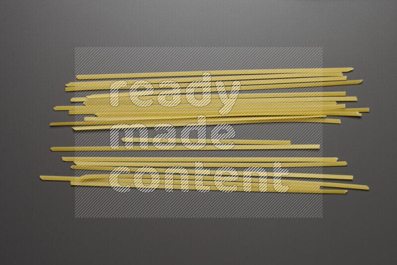 Linguini pasta on grey background