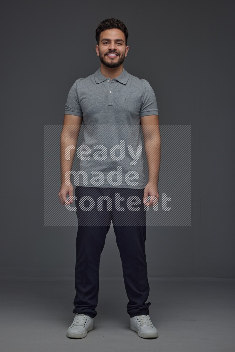A man wearing casual making multi stand poses  eye level on a gray background