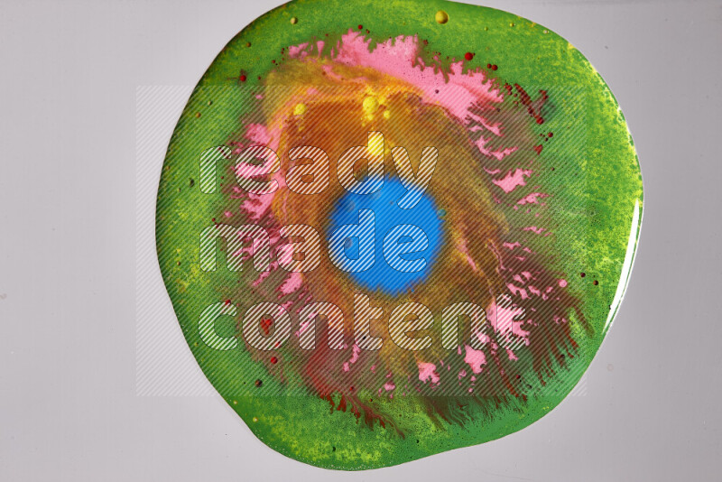 Close-ups of assorted colors blending on a grey background