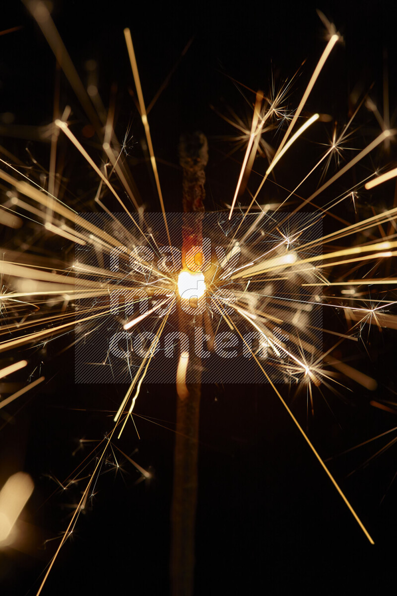 A close-up image of sparkler candle isolated on black background