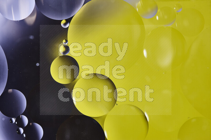 Close-ups of abstract oil bubbles on water surface in shades of black and yellow