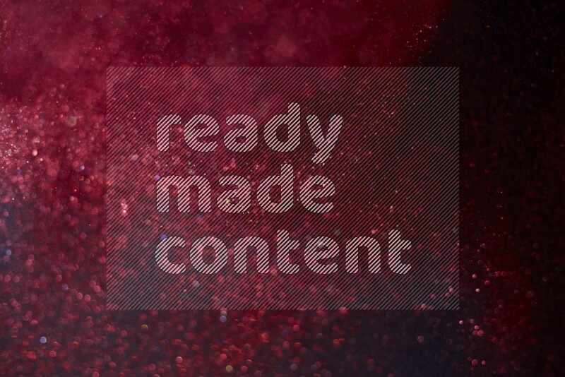 Red glitter powder isolated on black background