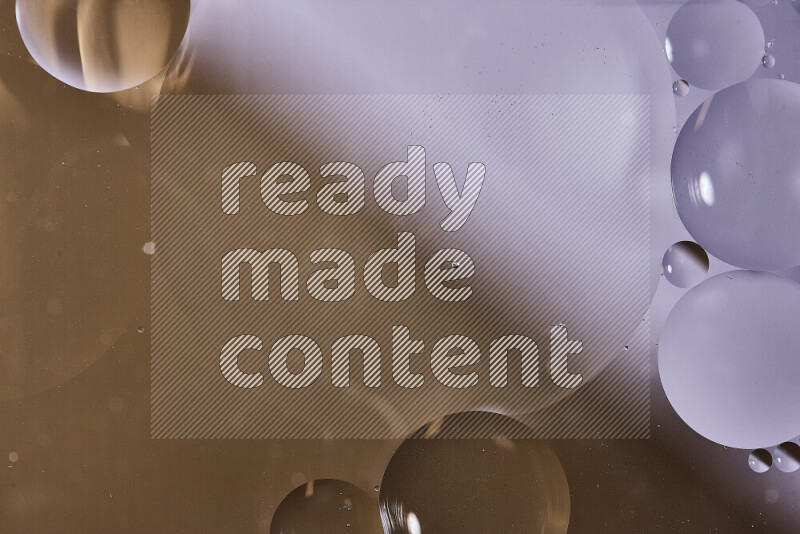 Close-ups of abstract oil bubbles on water surface in shades of white and brown