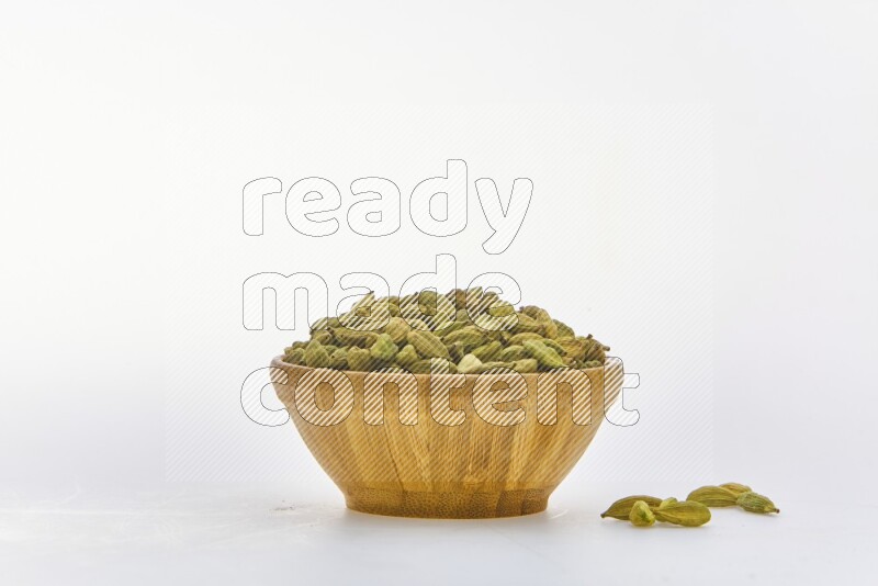 Cardamon in a container on white background