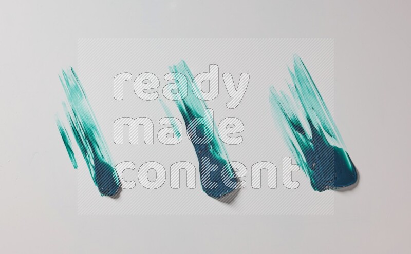 Turquoise painting knife strokes on white background