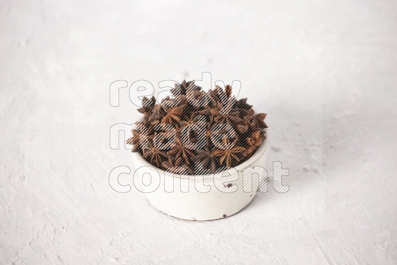 Star Anise in a white bowl on white background