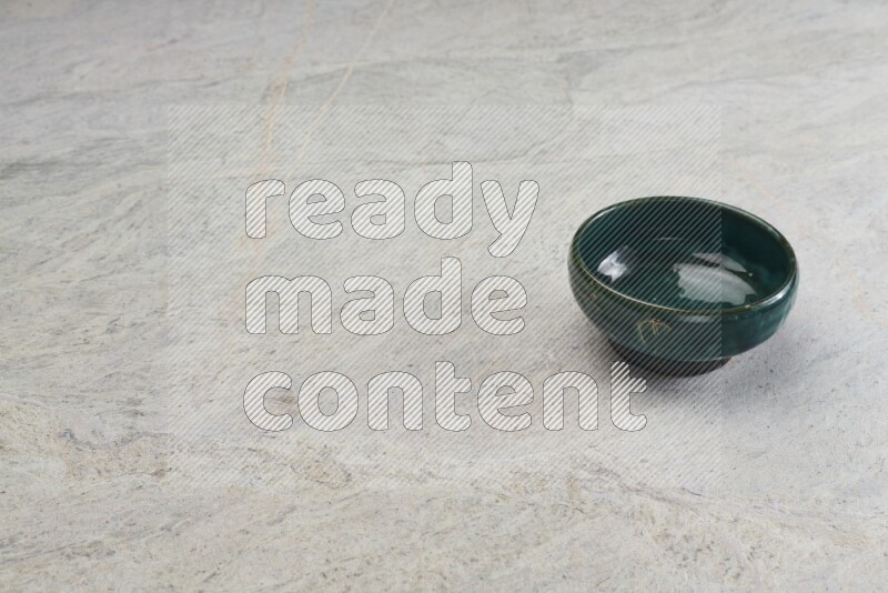 Dark Green Pottery Bowl On Grey Marble Flooring