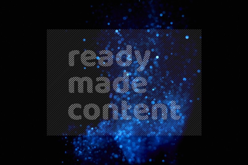 Blue glitter powder isolated on black background