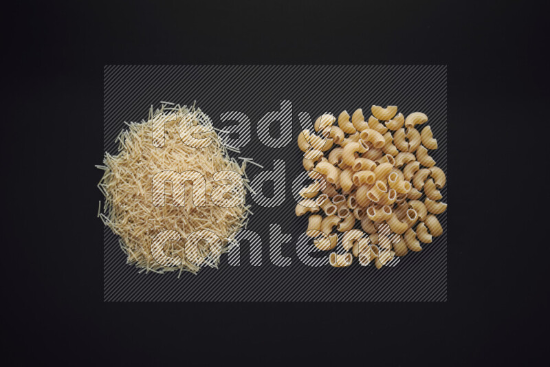 Different pasta types in bunches on black background
