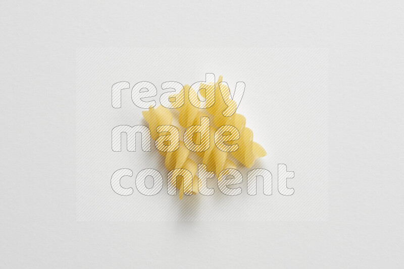 Fusilli pasta on white background