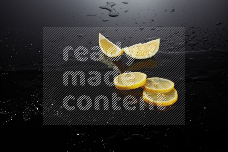 Lemon slices with water drops, and droplets on black background